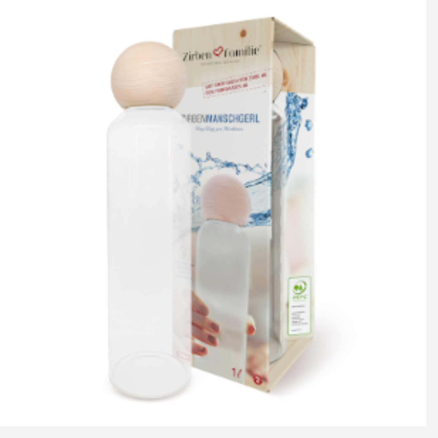 Umweltfreundlich und stilvoll: Die ZirbenManschgerl Glas-Trinkflasche mit rundem Holzdeckel steht neben ihrer Verpackung im Wasserspritzer-Design.
