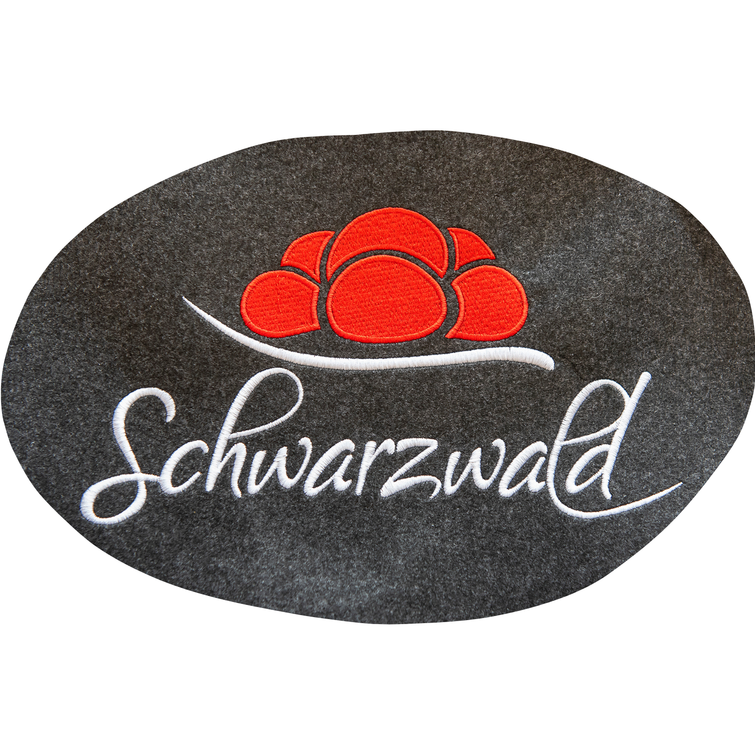Der Filz-Shopper - Schwarzwald zeigt das Wort Schwarzwald und eine rote Mützengrafik auf dunklem Hintergrund, wodurch ein kräftiges Schwarzwald-Motiv entsteht.